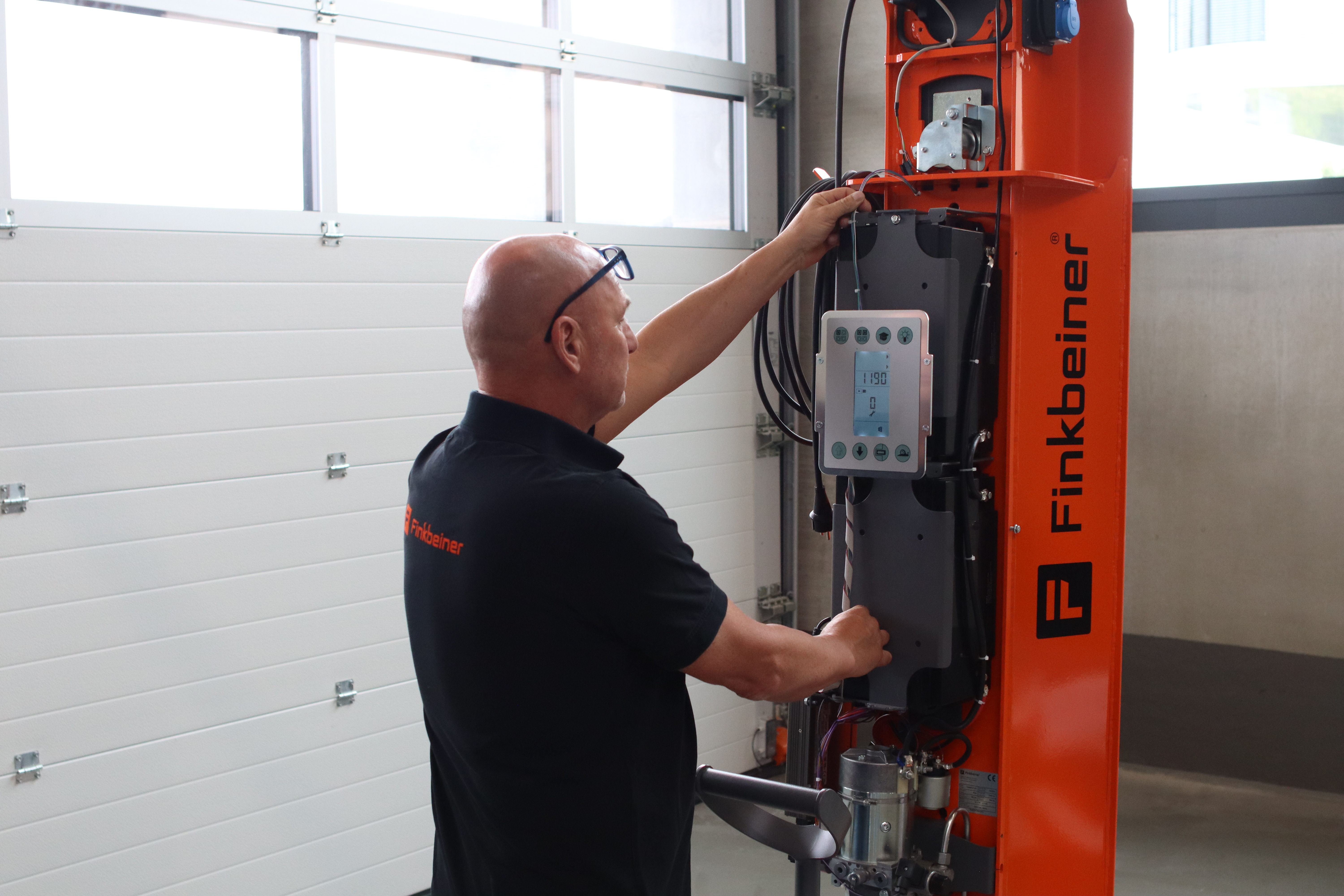 Finkbeiner technician installing a semi-scissor platform lift HDS